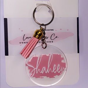 Customized keychain w/ a tassel.